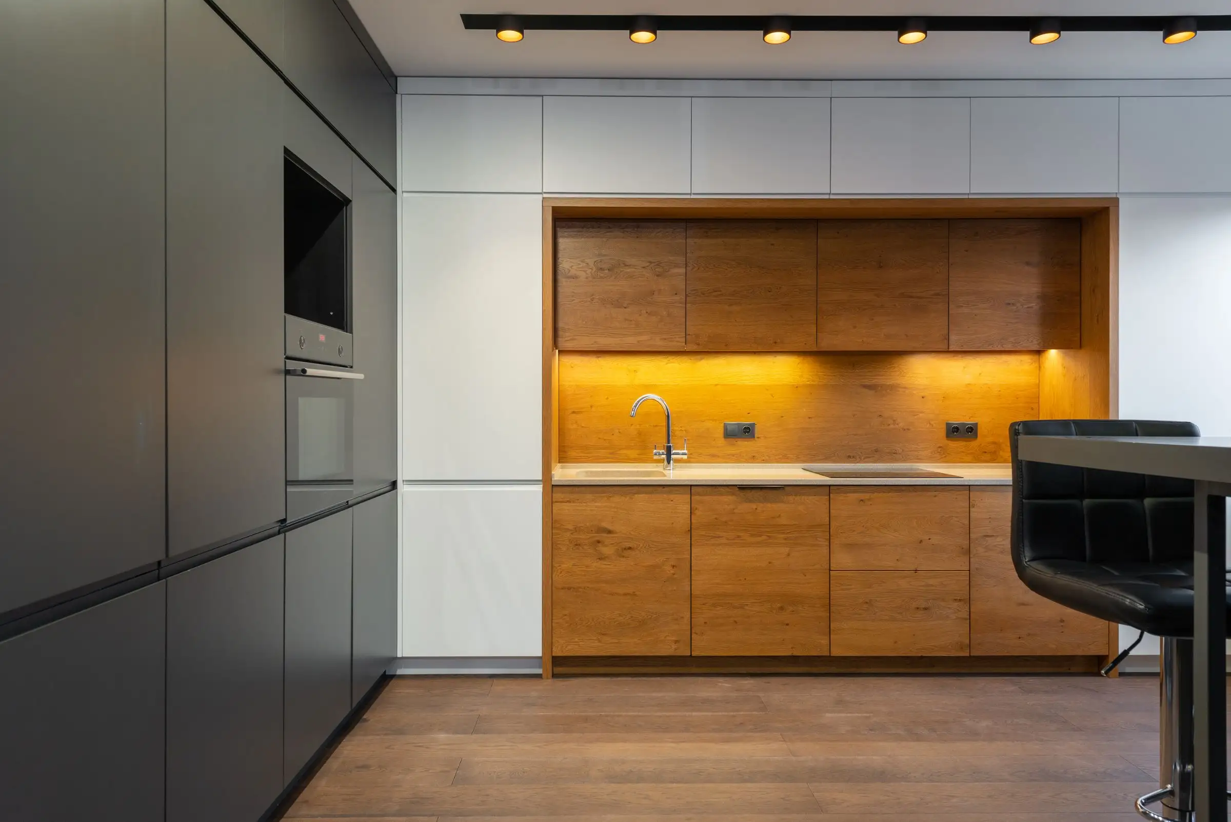 Kitchen with wood accents and a run of plain cabinets