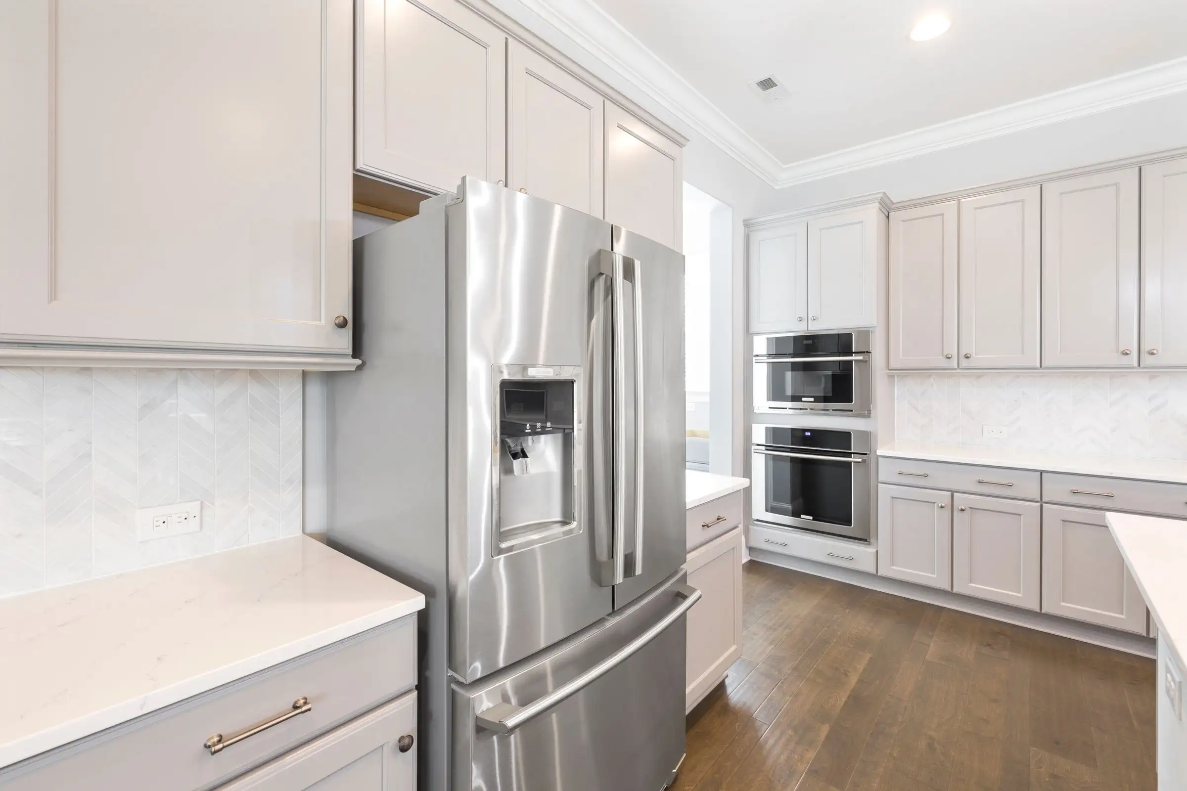 Run of stainless steel appliances built into a fitted kitchen